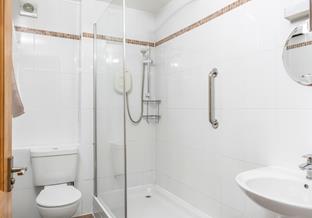Step into the shower and rinse off those sandy feet.