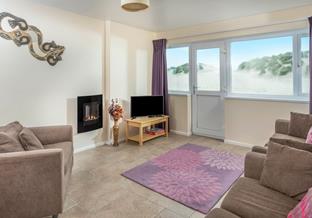 Enjoy beachside living at 1 Sand Bay!