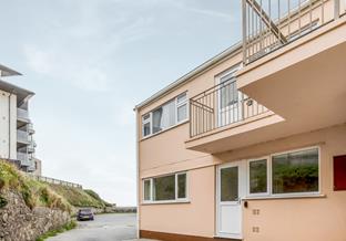 Sand Bay apartments are a level walk to the beach and high street shops, bars, and restaurants.