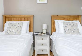 The twin bedroom is a coastal-inspired sanctuary.