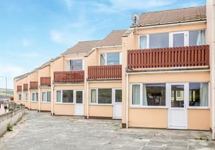 12 Sand Bay is a level walk to the beach and village amenities, all just moments away.