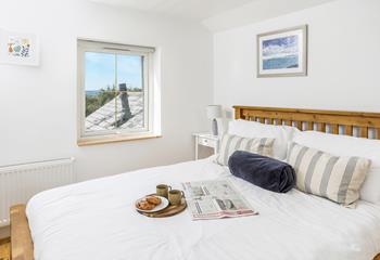 Wake up to sweeping views of the garden and countryside beyond.