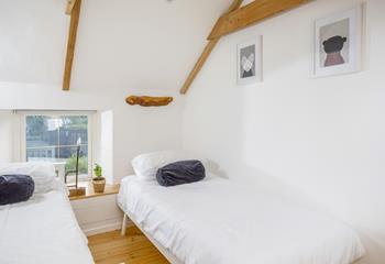 The cosy twin bedroom boasts more traditional features.