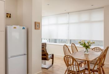 The light and airy L-shaped kitchen and diner has space for all the family to relax together.