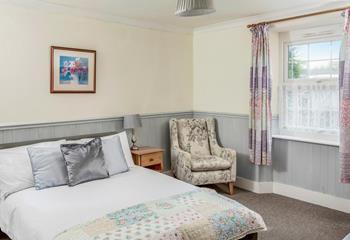 The country cottage feel continues in the master bedroom.