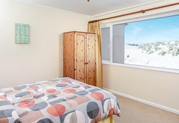 Wake up to views across the dunes in the double bedroom.