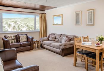 Enjoy the beautiful views from the sofa and the dining table.