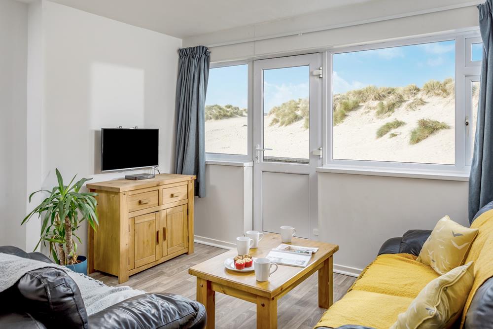 Located next to Perranporth's beach and sand dunes, beachside holidays don't get much closer!