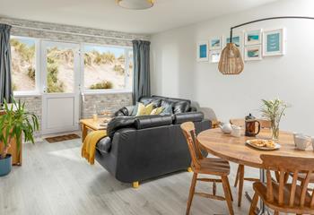 The open plan living area makes the most of the beachside views.