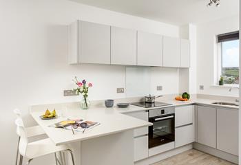 Cook and dine together in the contemporary kitchen.