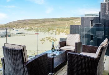 Unwind on the balcony with a good book and glass of wine!