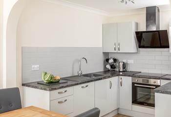 Cook and eat together in the open plan kitchen and diner.