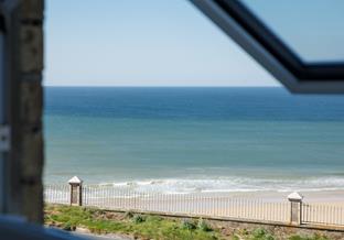 Gaze out to sea as the tide ebbs and flows.