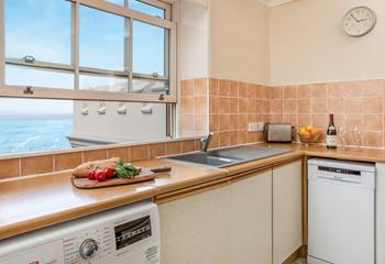 The kitchen is fitted with modern amenities, for holidaying with ease.