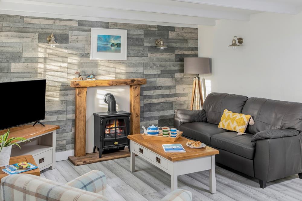 Spend a cosy evening in the sitting room after a day on Perranporth beach.
