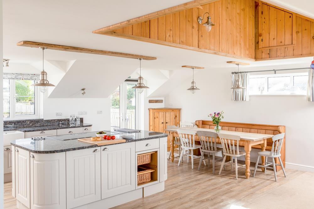 The large kitchen and dining area have plenty of room for all 8 guests to dine together.