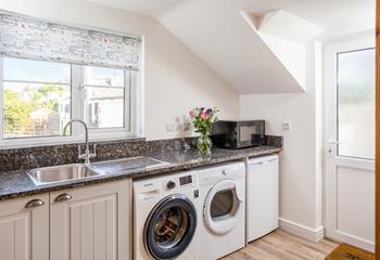 The added extras in the utility room include a washing machine for washing beach clothes.