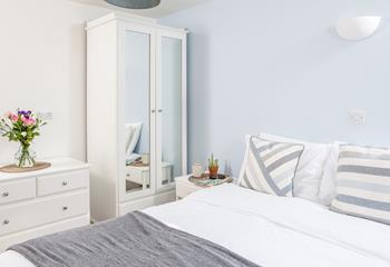 Bedroom 4 is stylishly furnished to create a lovely space to relax.