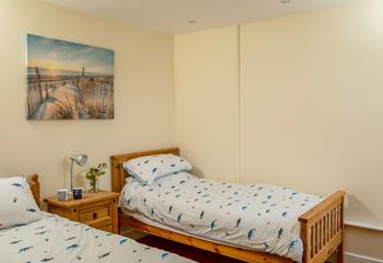 The kids will sleep well in the cosy twin bedroom after a day playing on the beach.