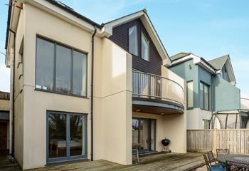 A modern coastal holiday home, Brea House is just a few minutes' walk from Perranporth's sandy beach.