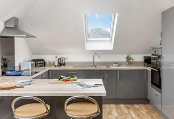 The kitchen breakfast bar, where family can gather whilst you cook up a feast.