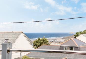 Far-reaching beach and sea views from the first floor balcony and living area.