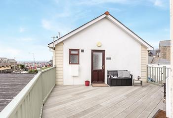 Relax on the decking, breathing in the fresh sea air.