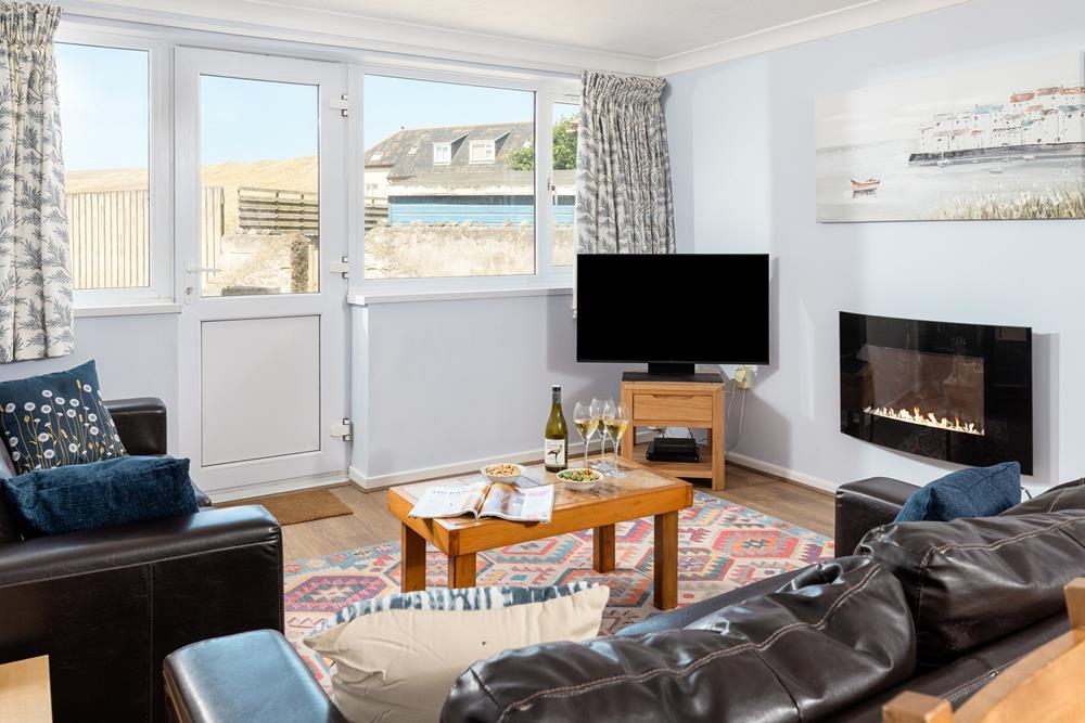 Find the beach on your doorstep and views of the sand dunes at 16 Sand Bay.