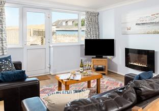 Find the beach on your doorstep and views of the sand dunes at 16 Sand Bay.