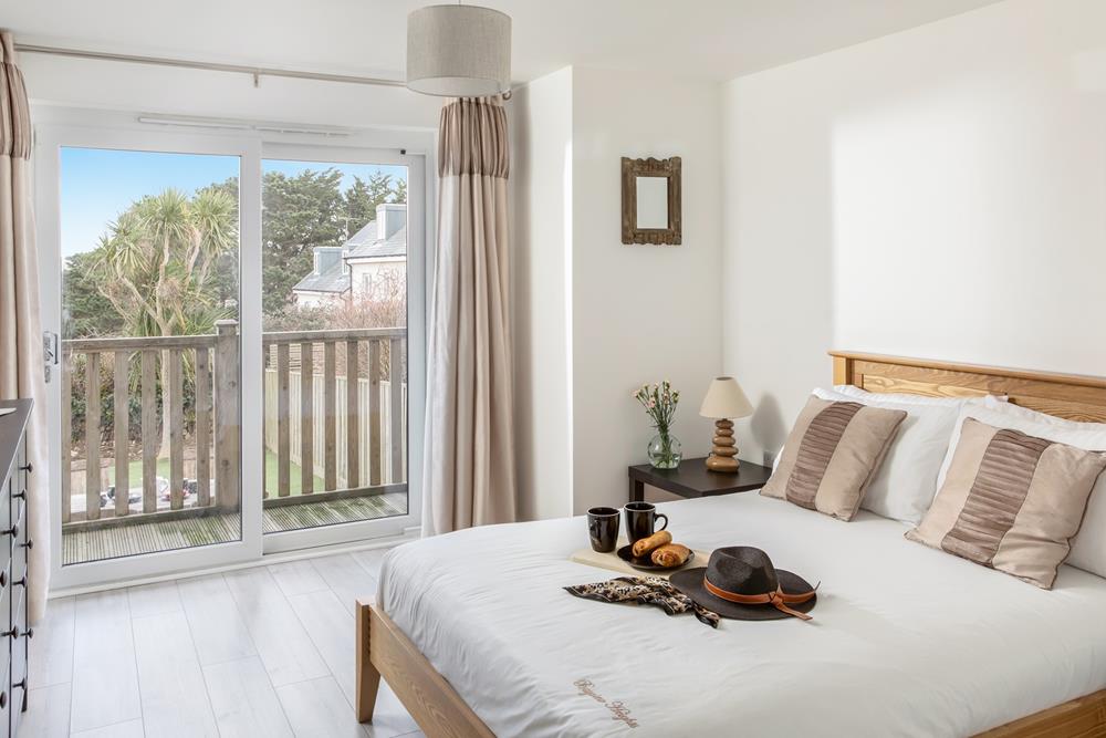 The double bedroom is a tranquil space where you'll comfortably drift off after a day on the beach.