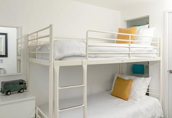 Kids will love staying in the light and bright bunk bedroom.