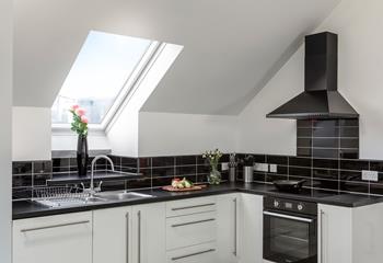 The sleek and modern kitchen is ideal for cooking up a storm.