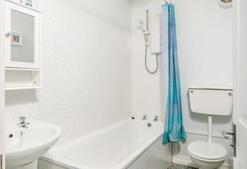 The family bathroom offers a shower and bath.