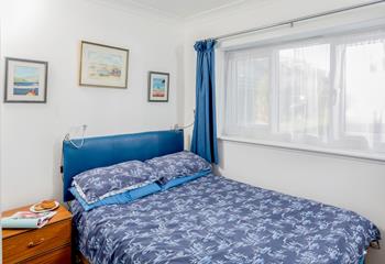 The second bedroom boasts a comfortable double bed.