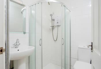 The bathroom features a family shower, perfect for sandy toes!