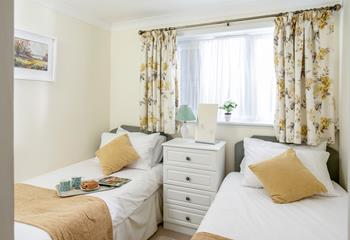 The delightful twin bedroom suits both adults and children.