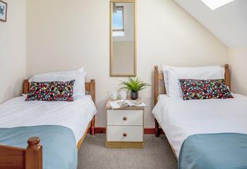 The delightful twin bedroom welcomes adults or little ones.