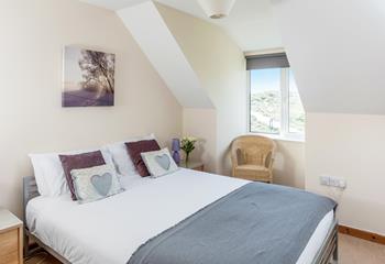 The double bedroom offers a serene space for a peaceful slumber.