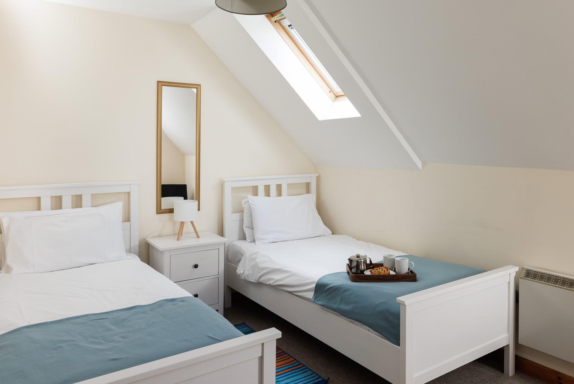 The delightful twin bedroom welcomes adults or little ones.