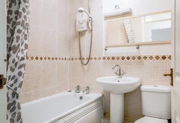 The family bathroom benefits from a bath and shower.