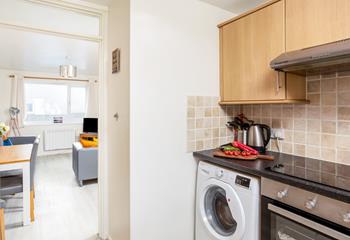 Step from the galley kitchen into the living space. 