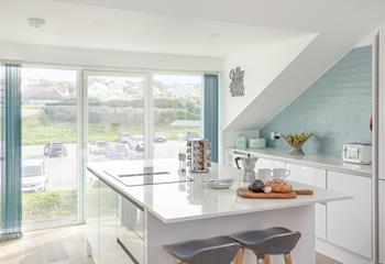 Enjoy getting creative in this sleek and stylish kitchen while enjoying dreamy ocean views! 