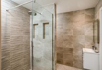 The stylish luxury bathroom is the perfect space to get ready in the morning.