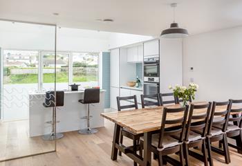 Cook and eat together in the welcoming dining space and kitchen.