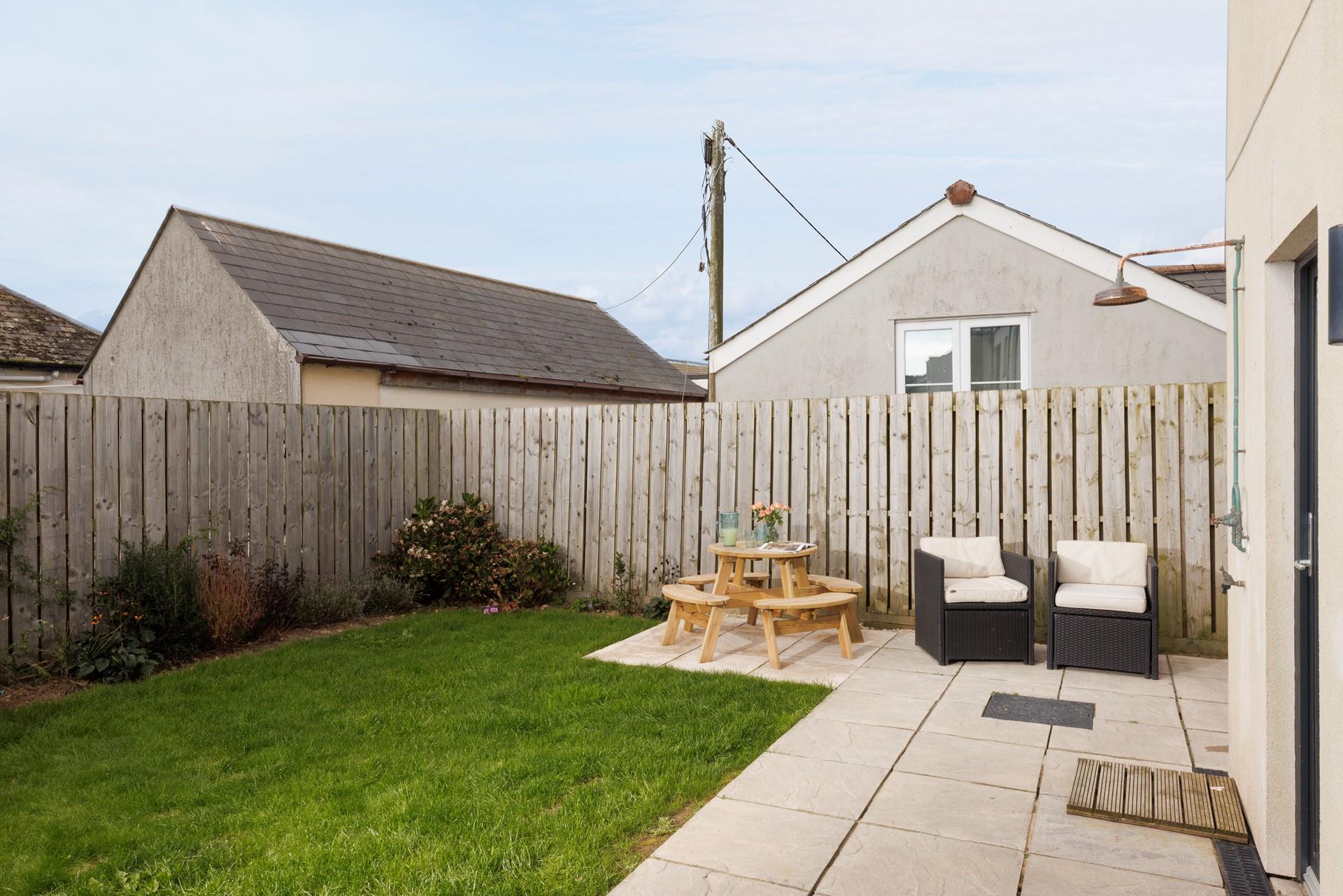 Wash off sandy paws under the handy outdoor shower!