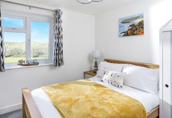 Wake up to serene views of the sand dunes in the master bedroom.