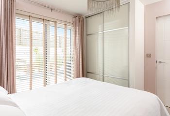 Decorated in shades of dusky pink, it's a calming and restful bedroom.