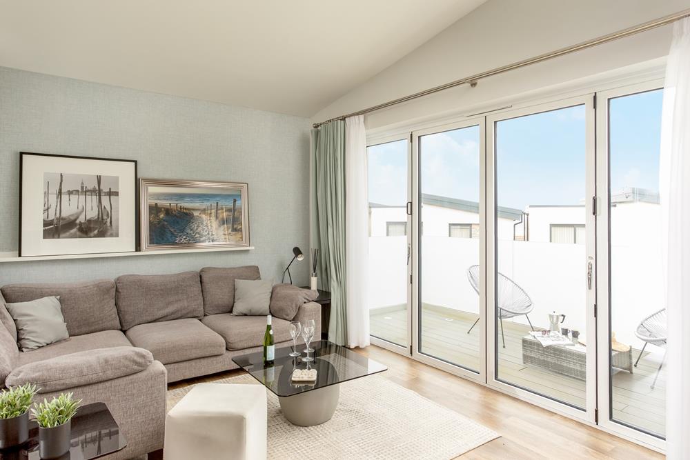 Step out onto the living room balcony and take your morning coffee with a side of fresh sea air.