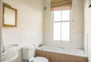 The family bathroom offers plenty of room; relax in the bath after a day walking the coast path.