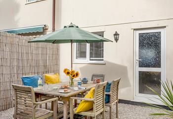 The courtyard is a lovely suntrap, perfect for relaxing after a day on the beach.